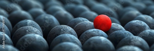 A red ball in a sea of blue stones with one stone standing out, AI photo
