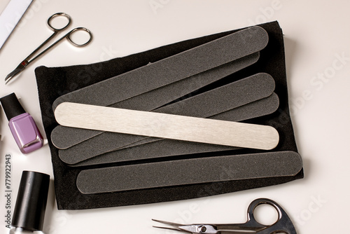 Manicure files with interchangeable files on the manicurist's table, top view. photo