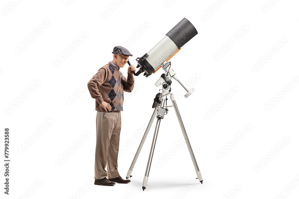 Elderly man observing the sky with a telescope