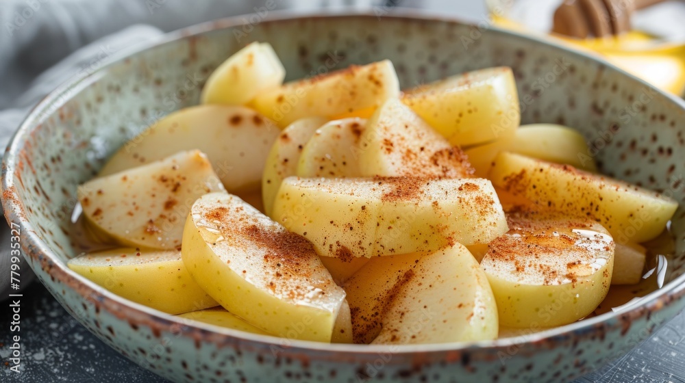 A bowl of sliced apples with cinnamon and sugar on a table, AI A bowl of sliced apples with cinnamon and sugar on a table, AI