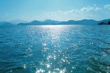 Tranquil marine landscape with shimmering water and sunlight, nature scenery
