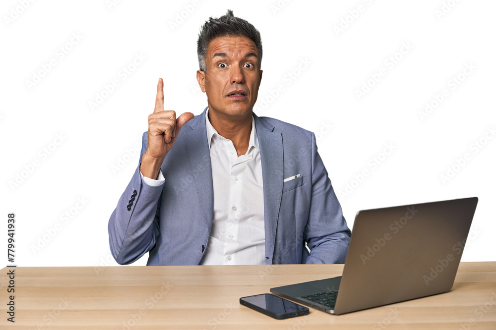 Elegant businessman at desk with laptop having an idea, inspiration concept. Elegant businessman at desk with laptop having an idea, inspiration concept.