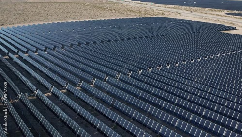 Aerial moving shot of solar panel field farm facility in Boulder City Nevada photo