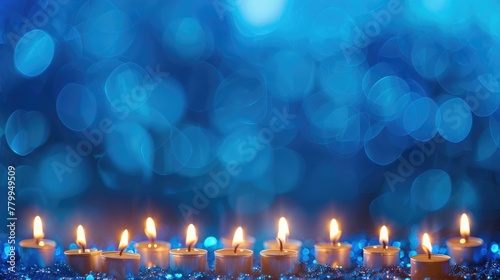 a border of gleaming menorah candles against a royal blue background.