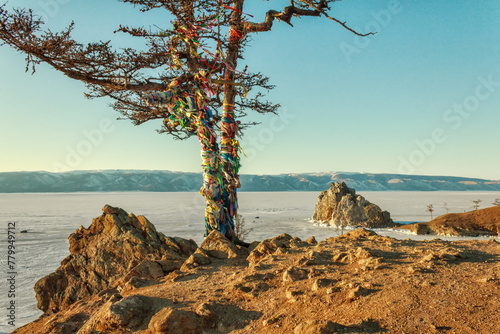 Winter landscape on Baikal lake with Shamanka rock, Olkhon island, Siberia, Russia. photo