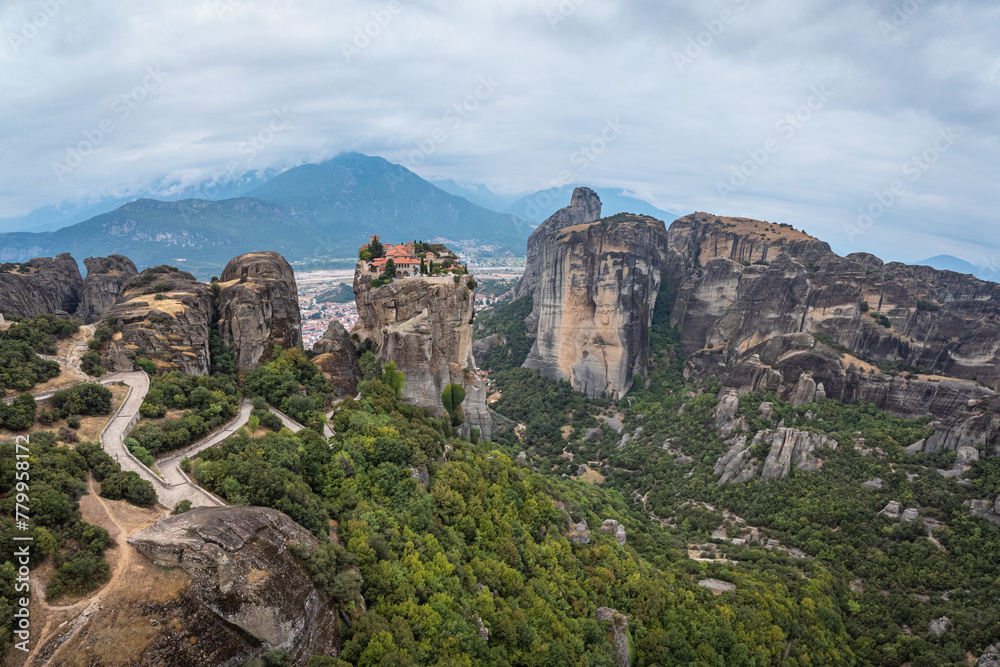 High aerial drone view of Monastery of the Holy Trinity (Agia Triada) in Meteora, Greece. A UNESCO World Heritage site.