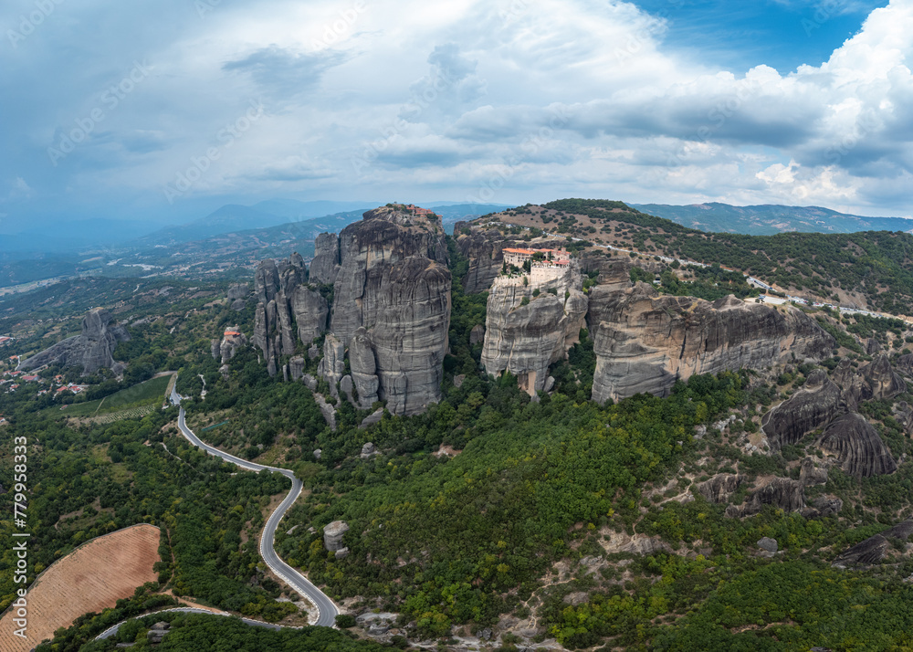 High aerial drone view of Monastery of Varlaam in Meteora, Greece. Iera Moni Barlaam, a UNESCO World Heritage site.