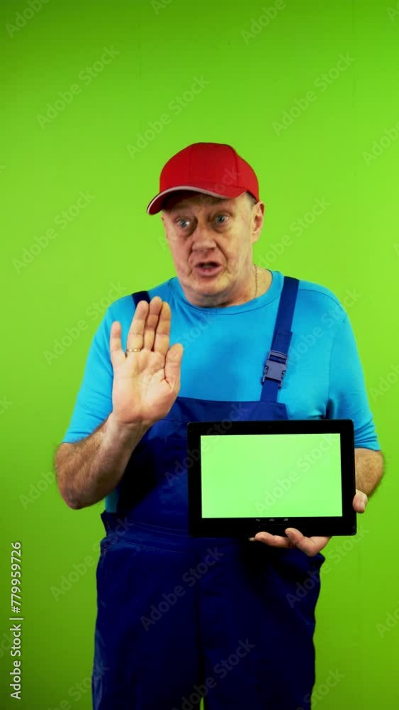 Senior repairman in overalls makes video lesson tells interesting information. Senior repairman in overalls makes video lesson tells interesting information.