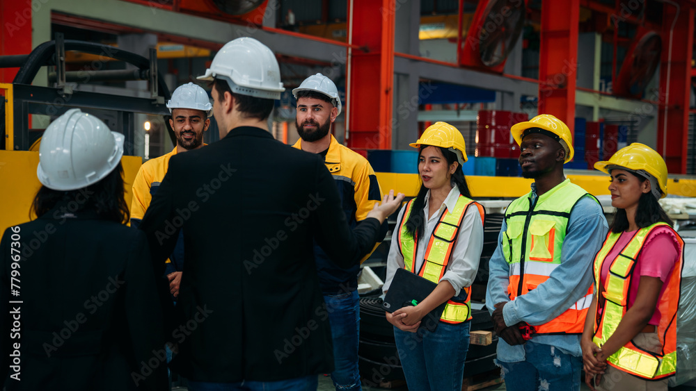 Obraz premium Team engineers and foreman stack hand and shake hands to show success at factory machines. Worker industry join hand for collaboration..