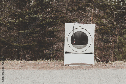 Obraz na plátně Old and discarded clothes dryer on the side of a rural road