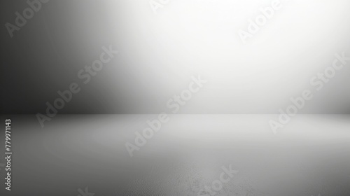 A background with a gradient from light to dark, with the lightest point being a blank white space. photo
