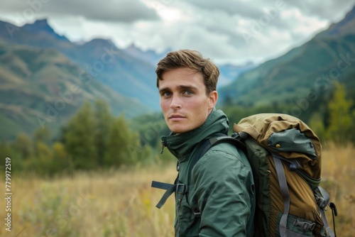 Portrait of a young man hiking through the mountains
