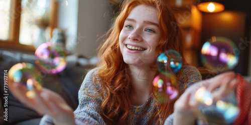 A woman with red hair is holding a bunch of bubbles and smiling. Concept of joy and playfulness, as the woman is engaging in a fun activity with the bubbles