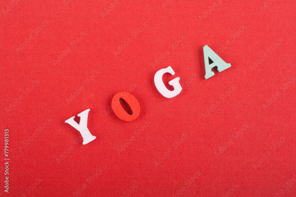 Yoga. composed from colorful abc alphabet block wooden letters. Yoga. composed from colorful abc alphabet block wooden letters.