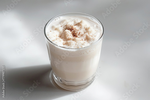Latte with whipped cream on a white background