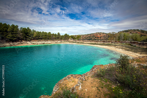 View of the Lengua lagoon in the Lagunas de Ruidera, Albacete, Castilla La Mancha, Spain, with an intense color and little water due to the pressing drought photo