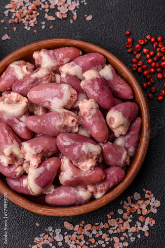 Raw chicken hearts with salt, spices and herbs