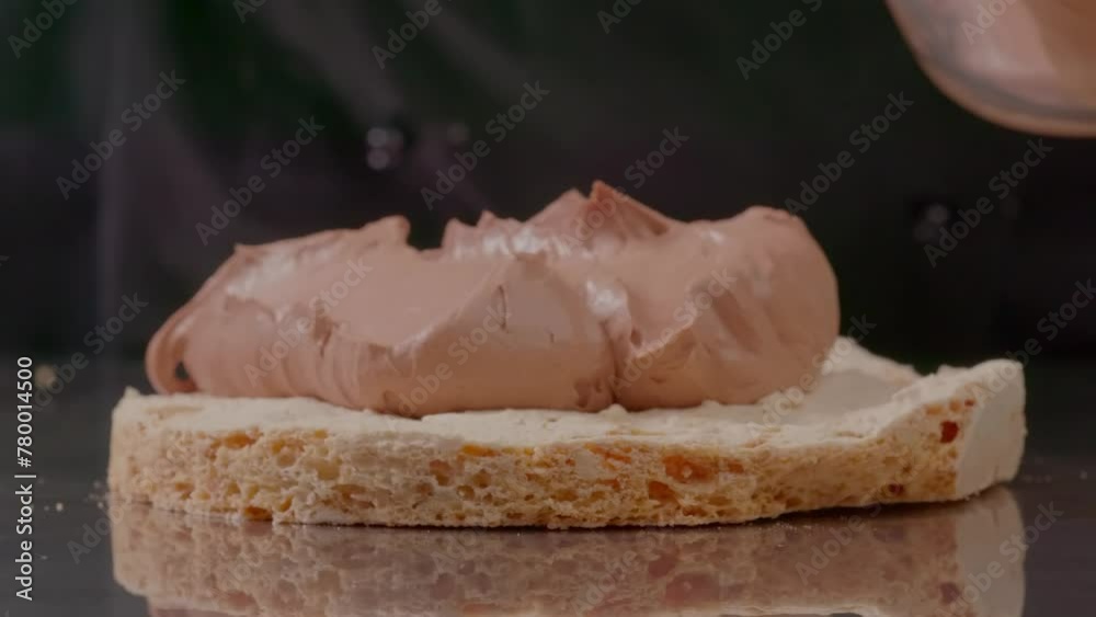 Culinar applying aerial cream on layers tart. Close up shot glazing layer tart. Adding more vanilla sauce on sides of the cake. Making a super sweet chocolate biscuit layer, pastry chef adding
