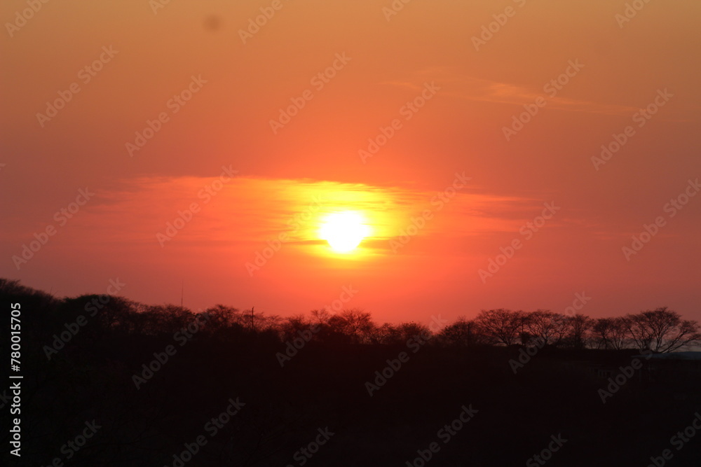 Fototapeta premium Golden Sunset Over Ocotal Beach, Costa Rica: A Tropical Paradise