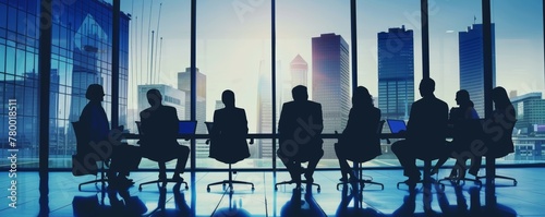 Silhouettes of business professionals in a meeting against city skyline. Corporate team working in a modern office with panoramic windows