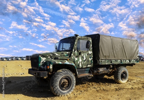 A damaged military truck on the battlefield. military technics.
