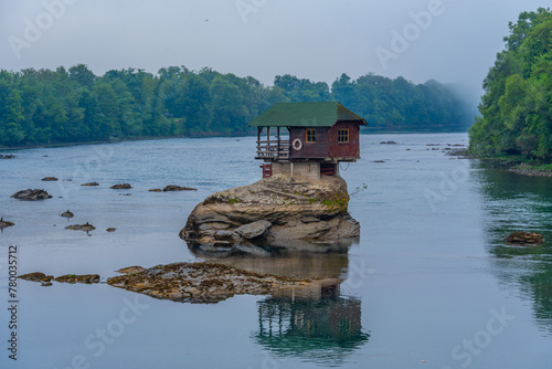 Wooden house on Drina river in Serbia photo