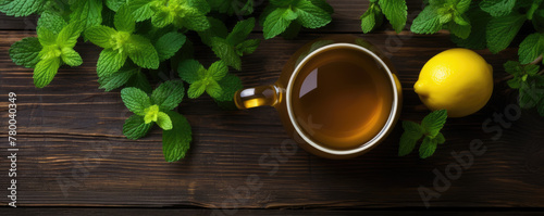 Mint Tea with fresh lemon on wooden board.