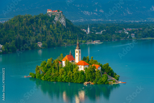 Assumption of Maria church and Bled Castle at lake Bled in Slove photo