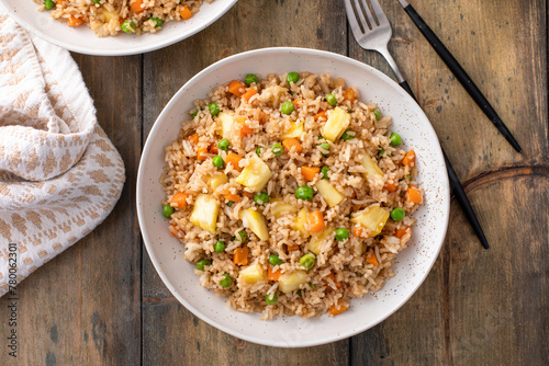 Vegan fried rice with pineapple, carrots and peas, balanced vegan meal
