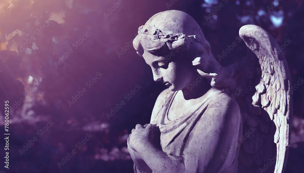 Gothic sad angel statue in cemetery, monochrome image, selective focus Gothic sad angel statue in cemetery, monochrome image, selective focus