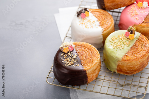 Obraz na płótnie Round croissants with filling and glaze, trendy dessert
