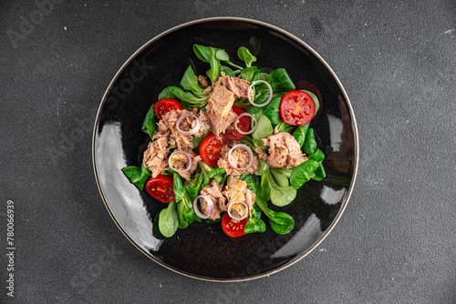 salad tuna, tomato, green leaf lettuce healthy eating cooking appetizer meal food snack on the table copy space food background rustic  © Alesia Berlezova
