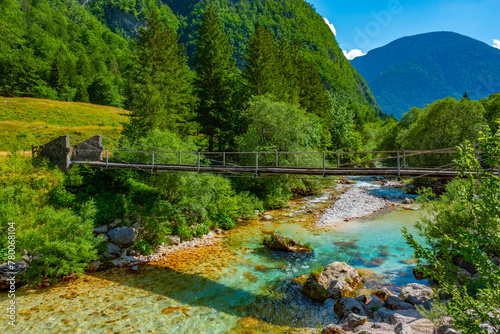 wooden bridge over soca river in Slovenia photo