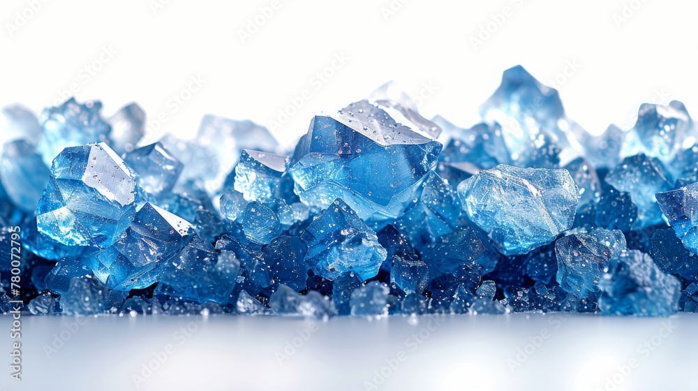 Against a white background, blue crystals of sea salt are visible
