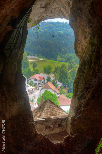 Cave behind the Predjama castle in Slovenia photo