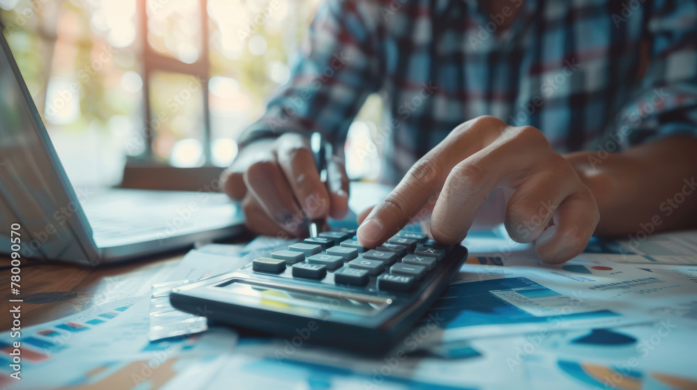 Businessman Working with Calculator in Office Environment Businessman Working with Calculator in Office Environment