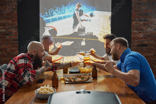 Men, sports enthusiasts gathering to watching online basketball match translation, cheering on their favorite team. Concept of sport, championship, game, sport fans, leisure