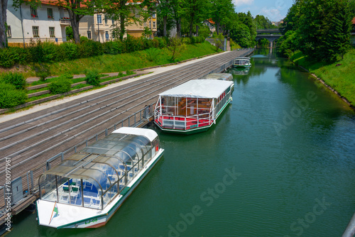 Tourist boats cruising Ljubljanica river in the Slovenian capita photo