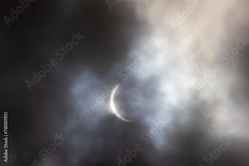 Solar Eclipse is seen through dramatic gray cloudy skies in Sussex County, New Jersey 