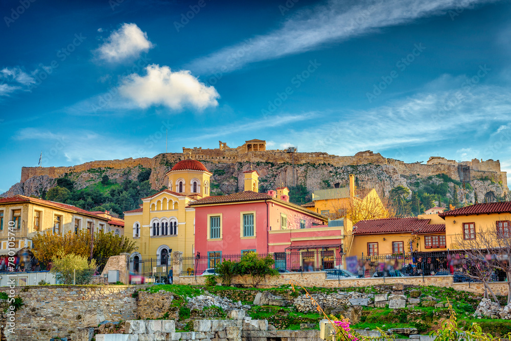 Plaka Athens with the rock of Parthenon at the background.