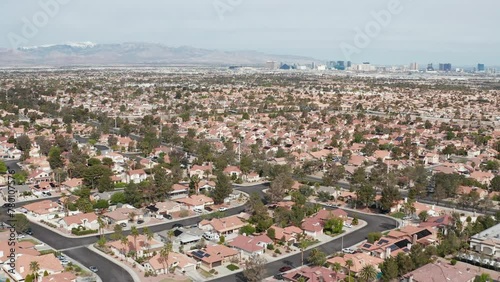 Aerial pullback shot of Henderson Las Vegas suburban area with city skyline