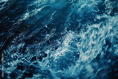 Dynamic ocean waves texture, close-up with deep blue hues, ideal for serene and nautical themes.