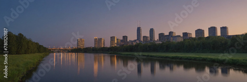 Sunset and Greater City in the background of a beautiful river lake