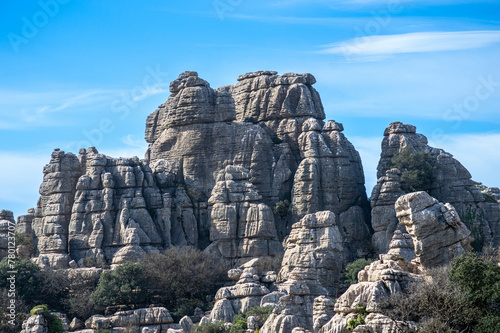 Hiking in the Torcal de Antequerra National Park, limestone rock formations and known for unusual karst landforms in Andalusia, Malaga, Spain.
