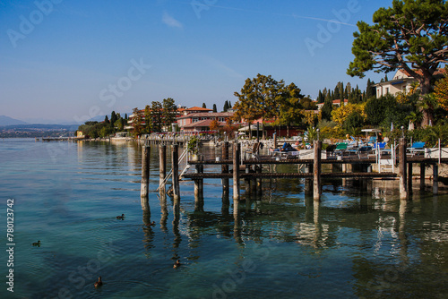  City of Sirmione on Lake Garda  wooden pier with built-up lake shore  Italy  Europe.