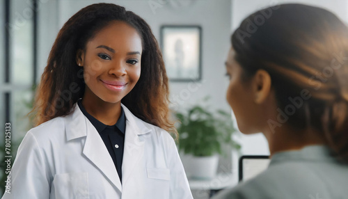 In a professional setting, a doctor stands ready to engage. The modern decor and the window sill adorned with plants reflect a calming atmosphere for conversation.