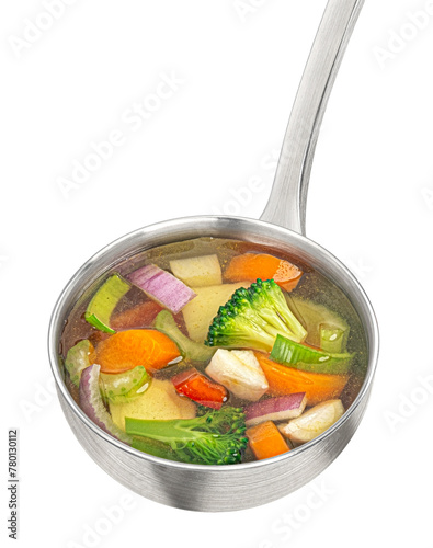 Ladle with vegetable soup isolated on white background
