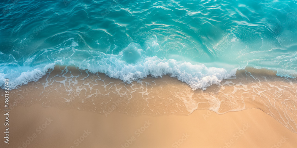 Serene aerial view of ocean wave meeting sandy shore