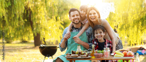 Happy family having picnic on summer day © Pixel-Shot