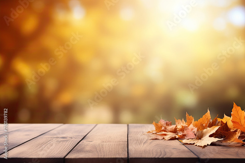 Golden Autumn Sunshine on a Wooden Table with Scattered Fall Leaves. copy space